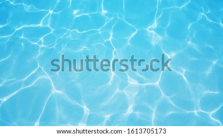 Pool Water With Shiny Rays. Clear Water With Shining Caustics. Royalty-Free Stock Photo #1613705173