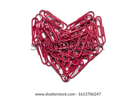 Heart of red paper clips isolated on white background. (Valentines day background)