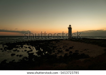 Remote lighthouse at a colorful sunrise