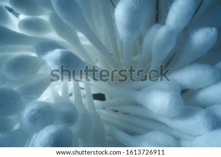 Background of cotton buds, macro frame on a light background