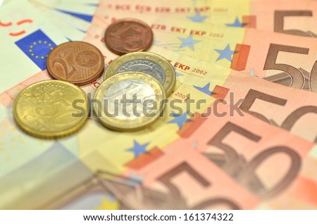 euro banknotes and coins 