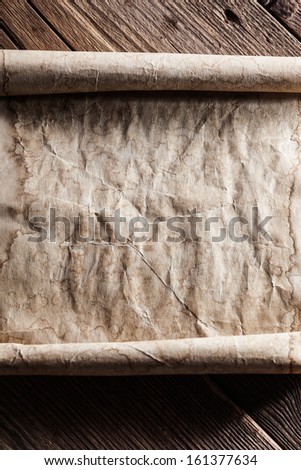 old paper on wood background