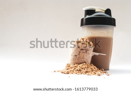 Whey protein powder with shaker for mixing Royalty-Free Stock Photo #1613779033