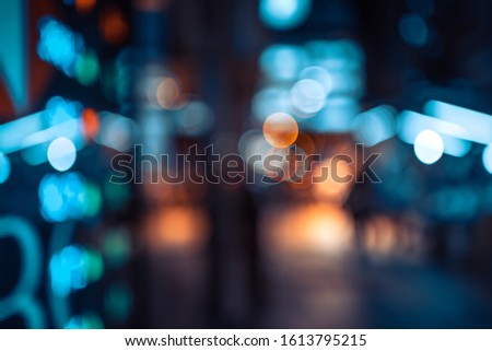 Display stock market numbers and graph with city light reflections at the street 
