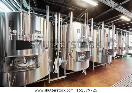 Row of tanks in microbrewery Royalty-Free Stock Photo #161379725