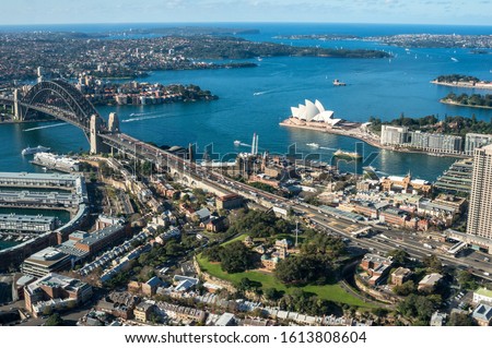 Aerial view of Sydney cityscape with Sydney Harbour and landmarks. Modern urban cityscape view from above. Sydney aerial drone view travel destination background 