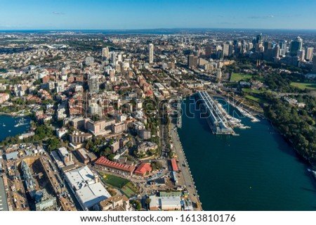 Aerial view of Sydney Business District and suburbs with Woolloomooloo wharf. Modern city view from above with lagoon. Urban aerial photo panorama 