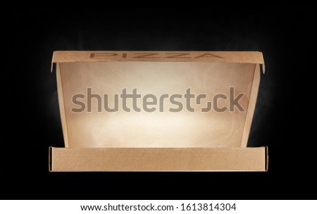 Half-open pizza box with rising steam isolated on a black background. Front view.
