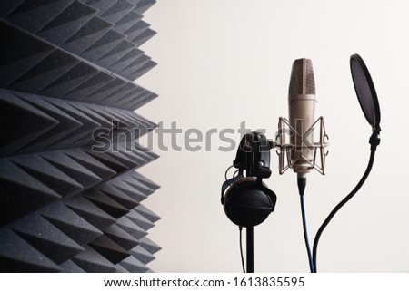 Recording studio equipment: microphone, acoustic foam, headphones Royalty-Free Stock Photo #1613835595
