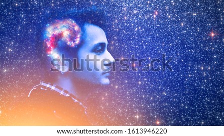 Human spirit, astronomy, life zen inner peace concept. Double multiply exposure abstract portrait of a dreamy young man face, galaxy universe space inside head Elements of this image furnished by NASA Royalty-Free Stock Photo #1613946220