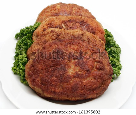 Meatballs, parsley on a plate, white background