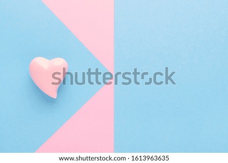 pink and blue background with a heart and copy space
