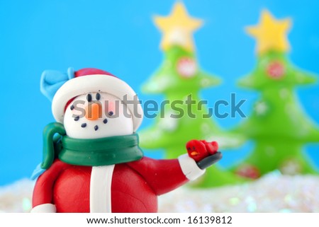 fantasy wonderland scene with  snowman  and christmas trees in the background