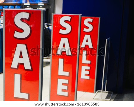 Entrance to the store with sales. Bright sign Sale at the entrance to the store in the shopping center. 