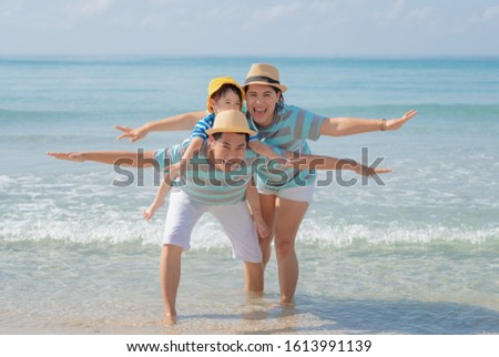 Happy asian family on the beach. Happy family concept