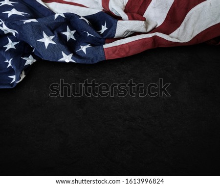 Flag of the United States of America on cement background with copy space