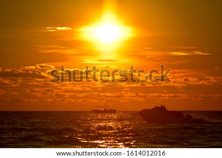sunset beach. boat .red sky