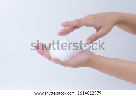 white Soapy foam bubbles texture on woman hand