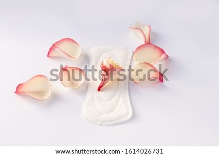 Woman hygiene protection with 
rose petals isolated on a white background 