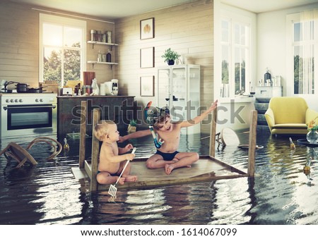 kids pday on the table while flooding in the kitchen. Photo and media photocombination Royalty-Free Stock Photo #1614067099