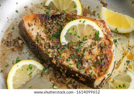 Pan-Seared Lemon Garlic Swordfish in a Skillet Royalty-Free Stock Photo #1614099652