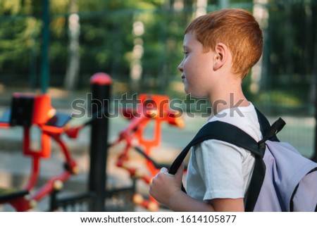 A boy on public street simulators. Children's sports