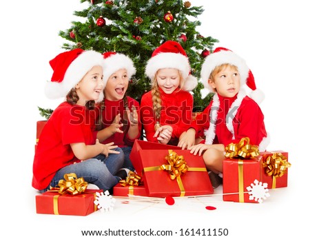 Christmas kids in Santa hat  with presents sitting under fir tree. White background.