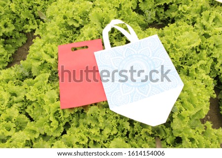 PP Non Woven Fabric Shopping Bags isolate on green background, Eco Friendly tote Bags, Polypropylene Grocery Bags. Save earth. save nature. environment day concept 