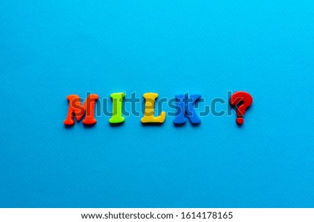 colored word "milk" from plastic magnets