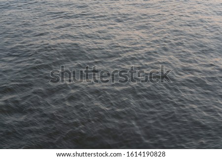 Water surface with beautiful waves background
