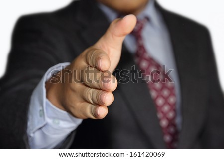 male businessman offering handshake for a business deal