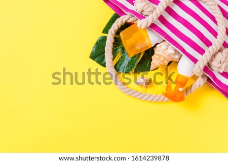Summer bag background with copy space. Flat lay photo on color table, travel concept. Free space for text, mock-up.