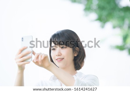 young woman uses smart phone