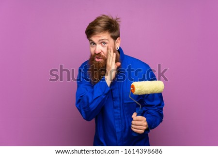 Painter man with long beard over isolated purple background whispering something