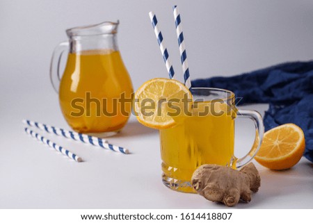 Homemade invigorating drink with lemon, ginger, honey and turmeric on a white background, Horizontal orientation, Closeup