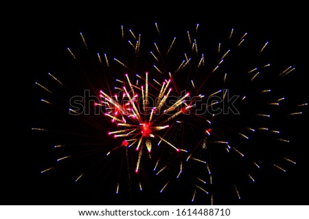 A low angle view of colorful fireworks in the sky during the night - a cool picture for backgrounds