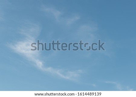 Turquoise sky with some clouds, vast nature, beautiful in summer, used as a background