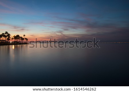 Evening on Tampa Bay as the sun goes down with blue skies and reflecting color on the water