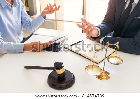 Legal counsel presents to the client negotiating a contract Serious consultations, Concepts of Law and Legal services.
