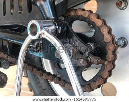 Rusting on a motorcycle chain. Detail of a motorcycle rear chain.