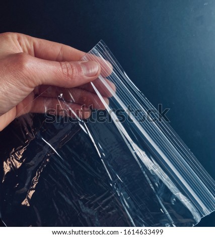 Shiny Ziploc Bag storage bag with black background Royalty-Free Stock Photo #1614633499