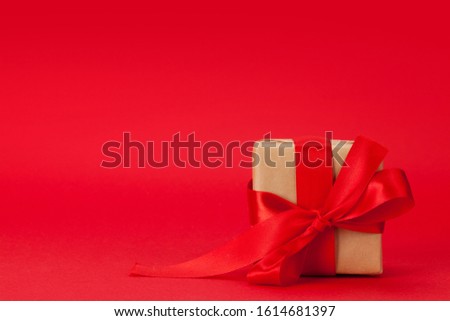 Valentines day gift box over red background with copy space for your greetings