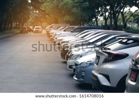 the cars in the parking lot on sunset background