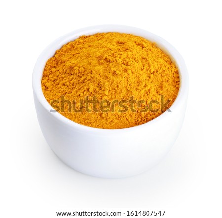 Bowl with turmeric powder isolated on white background. With clipping path.