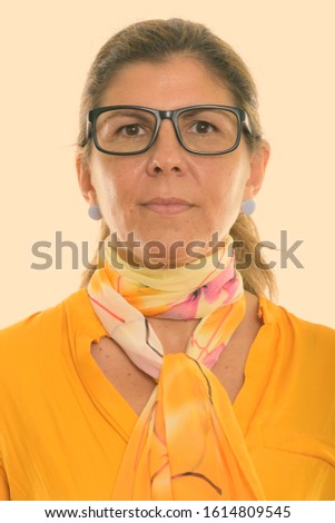 Face of mature beautiful businesswoman wearing eyeglasses
