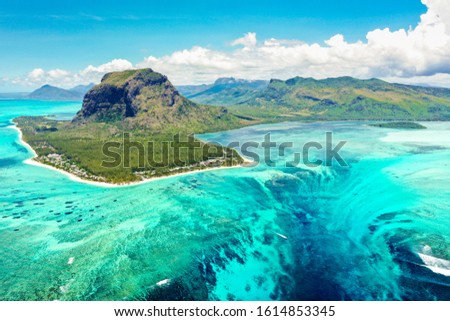 Aerial panoramic view of Mauritius island - Detail of Le Morne Brabant mountain with underwater waterfall perspective optic illusion - Wanderlust and travel concept with nature wonders on vivid filter Royalty-Free Stock Photo #1614853345