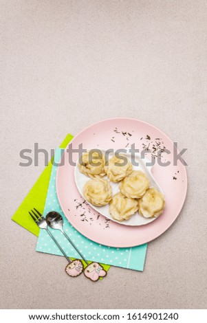 Fish dumplings. The concept of healthy food for children. Kids cutlery, stone concrete background, copy space, top view