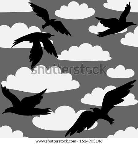 Black flying birds' silhouettes on the background of grey sky and white clouds. Seamless pattern. Vector graphics.
