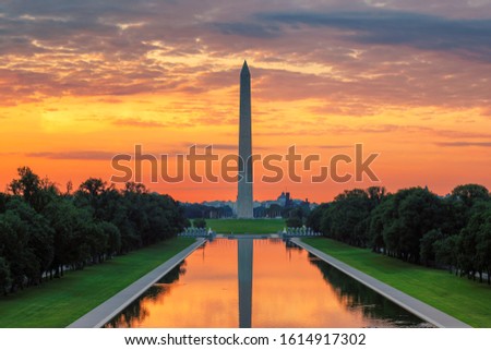 Beautiful sunrise at Washington Monument in new reflecting pool by Lincoln Memorial, Washington DC, USA.