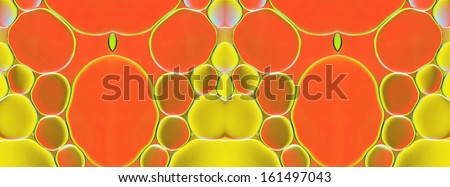 Kaleidoscopic pattern of oil drops on water